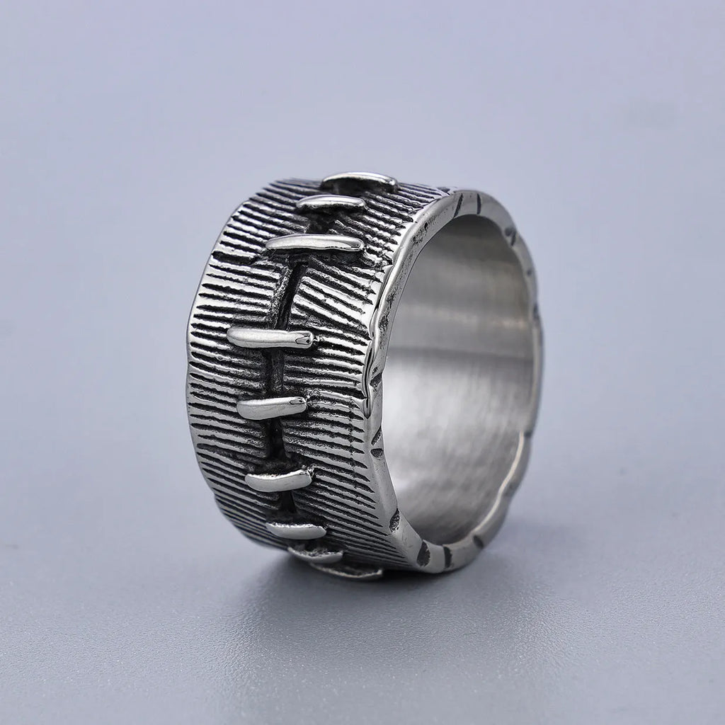 Titanium steel geometric U-shaped double ring with stitched texture in a retro colour.
