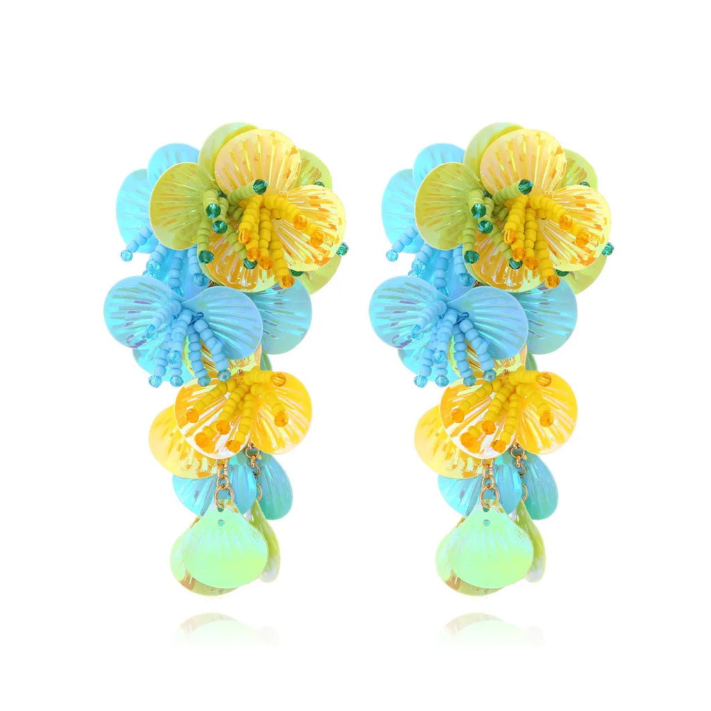 Handmade colourful bead flower earrings with leaf designs in exaggerated dopamine style