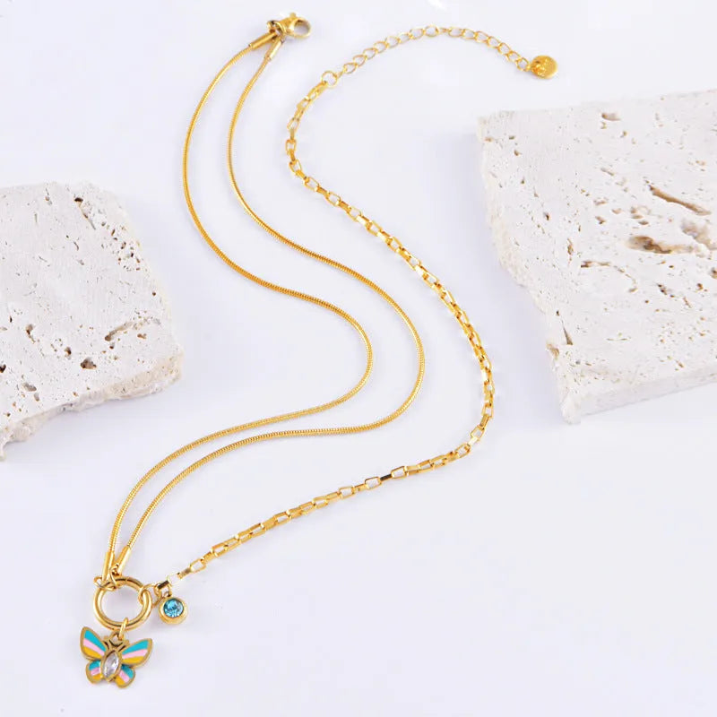 Gold titanium steel butterfly necklace and bracelet set with epoxy colourful detailing on snake bone chains