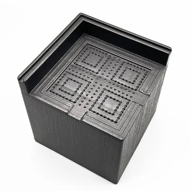 Four black plastic bed foot mats for raising furniture height with modern simple style
