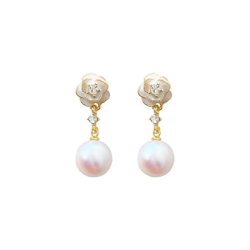 A pair of camellia flower stud earrings for women with a pearl centre, made from alloy.