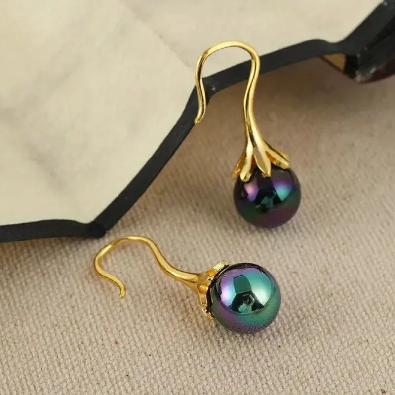 Women's retro fashion earrings with electroplated gold finish and dangly drop design