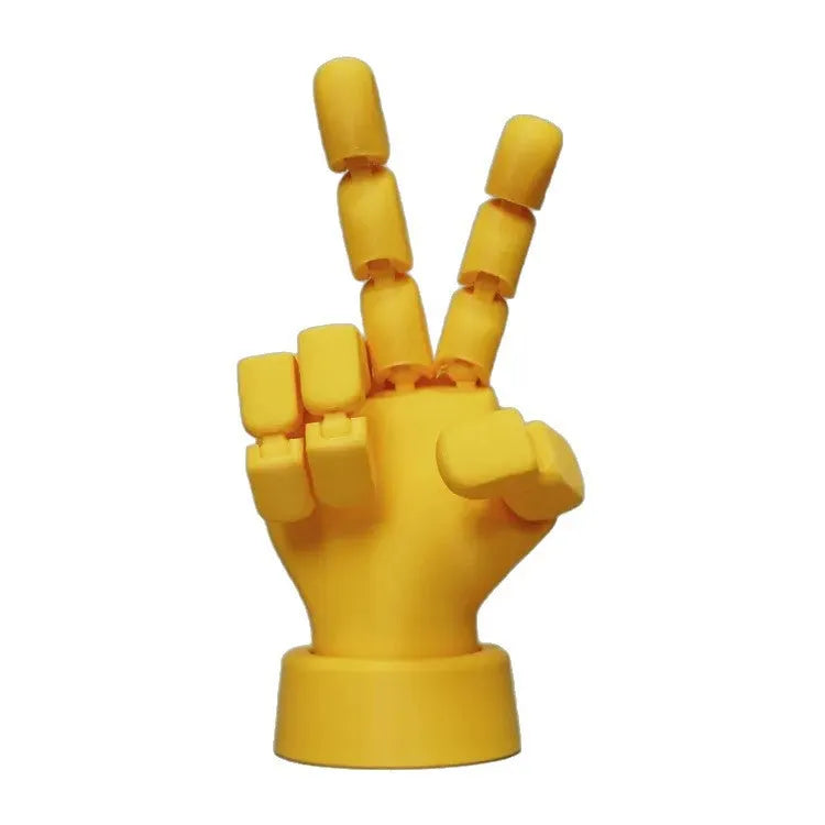 Yellow PLA movable joint hand prop figurine on a white background.