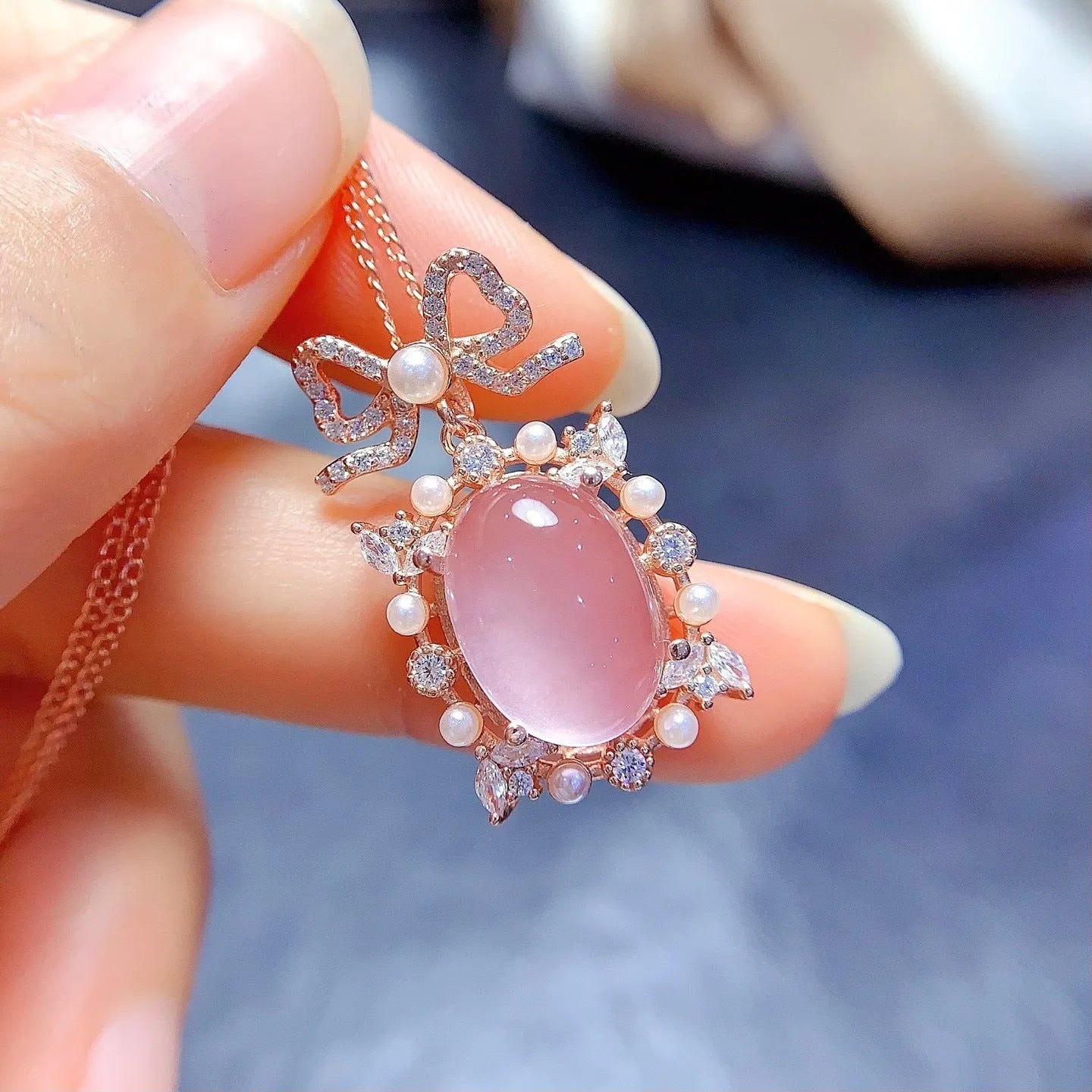 Geometric silver pendant with rose quartz stone and rose gold plating on an alloy chain