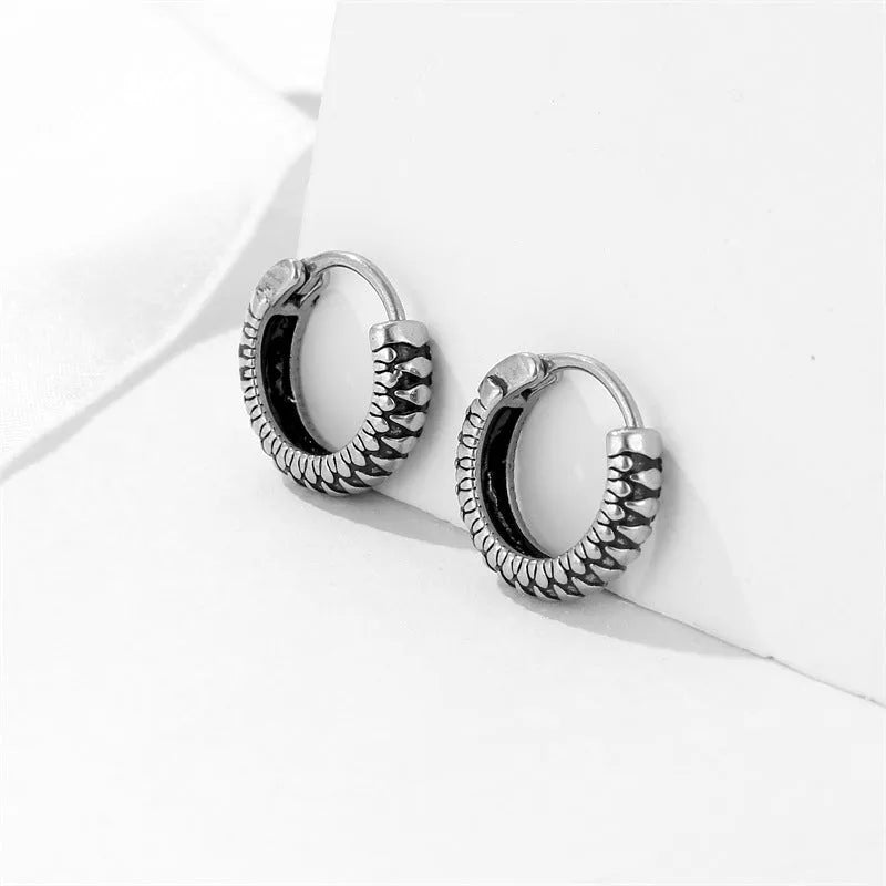 Silver geometric stripe earrings with retro twist design and sports style aesthetic