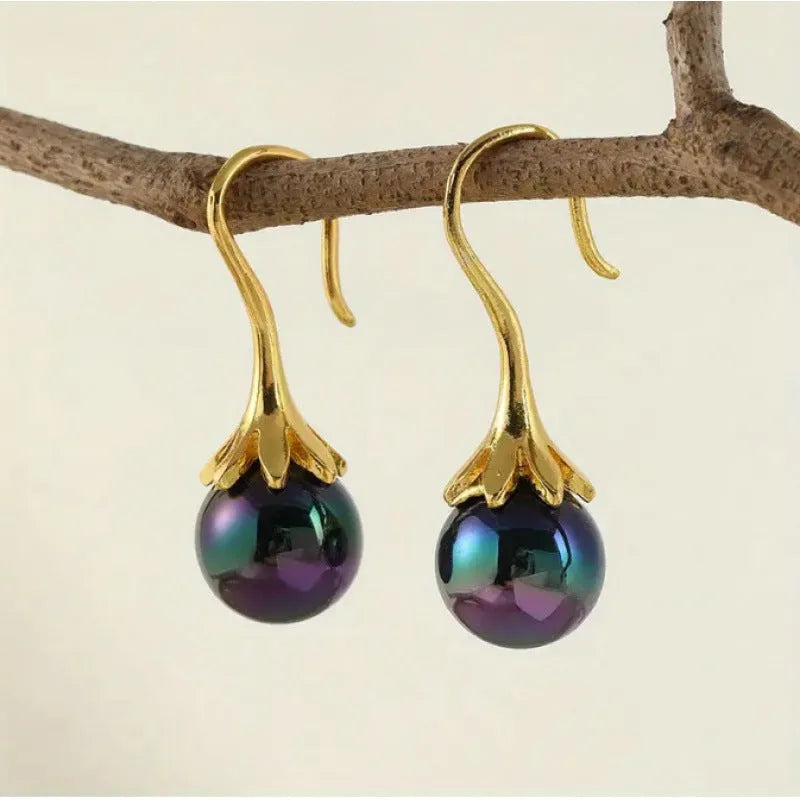 Women's retro fashion earrings with electroplated gold finish and dangly drop design