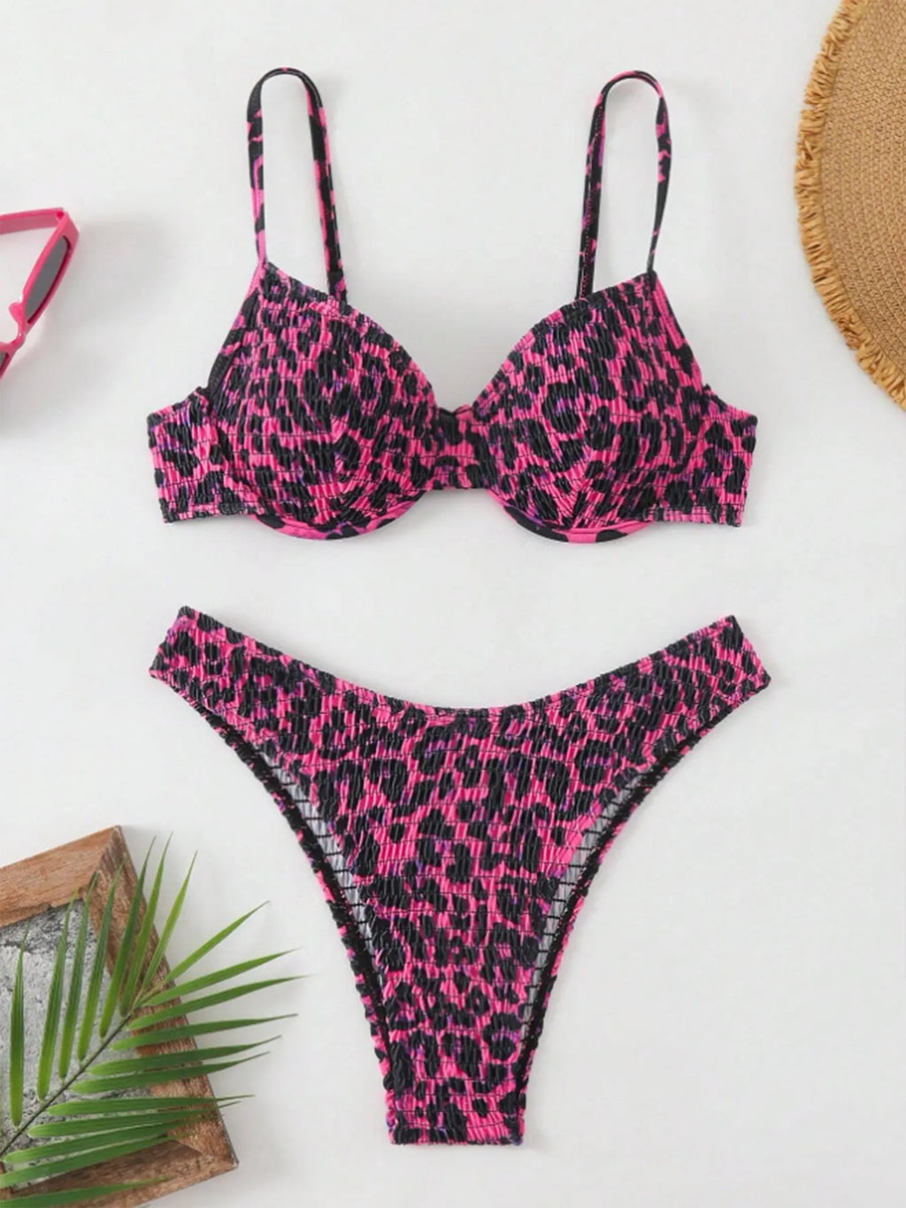 Women's leopard print bikini set with backless design in brown and red colour options.