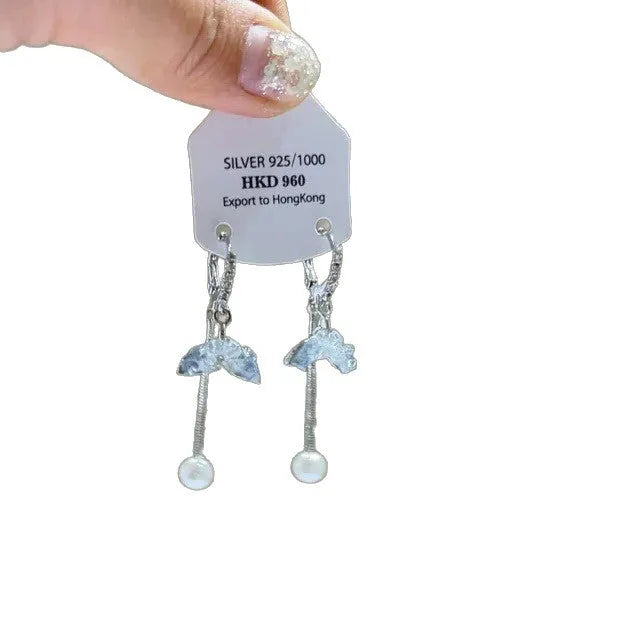 Geometric heart-shaped women's clip-on earrings with rhinestone stars and a tassel detail in a metallic finish.