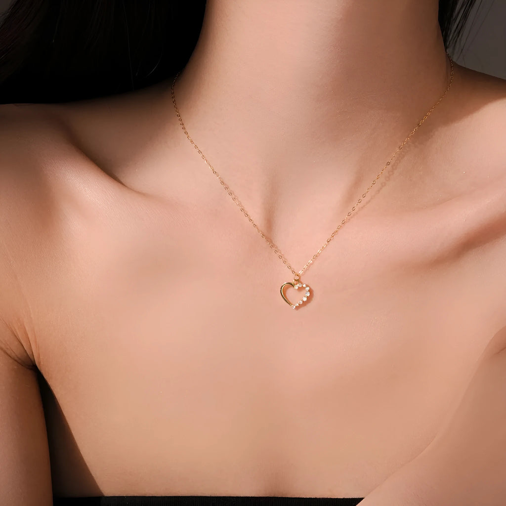 Sterling silver hollow heart pendant necklace on a regular chain, shown in a white gold colour finish.