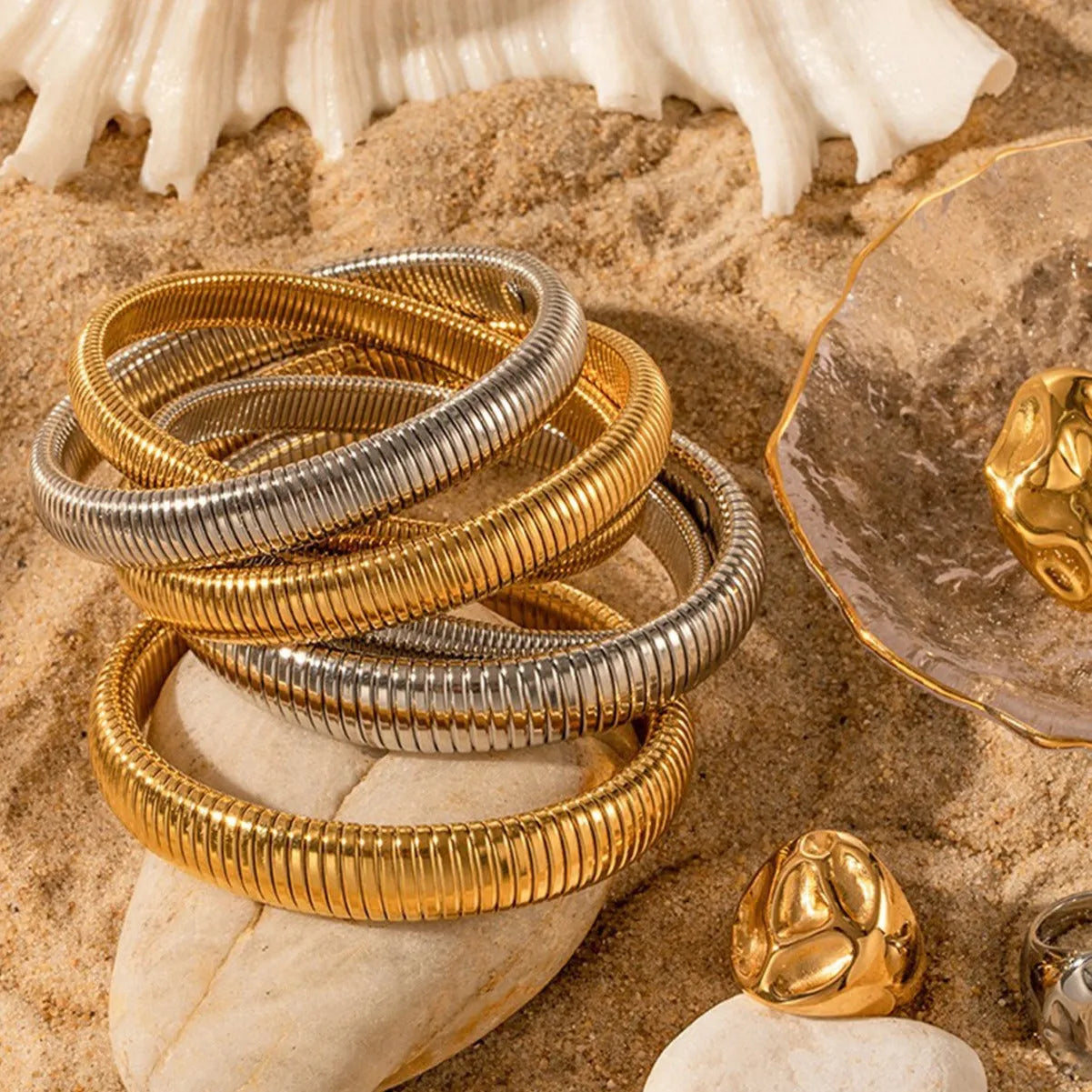 Women's titanium steel bracelet with vertical stripe ring pattern in gold colour