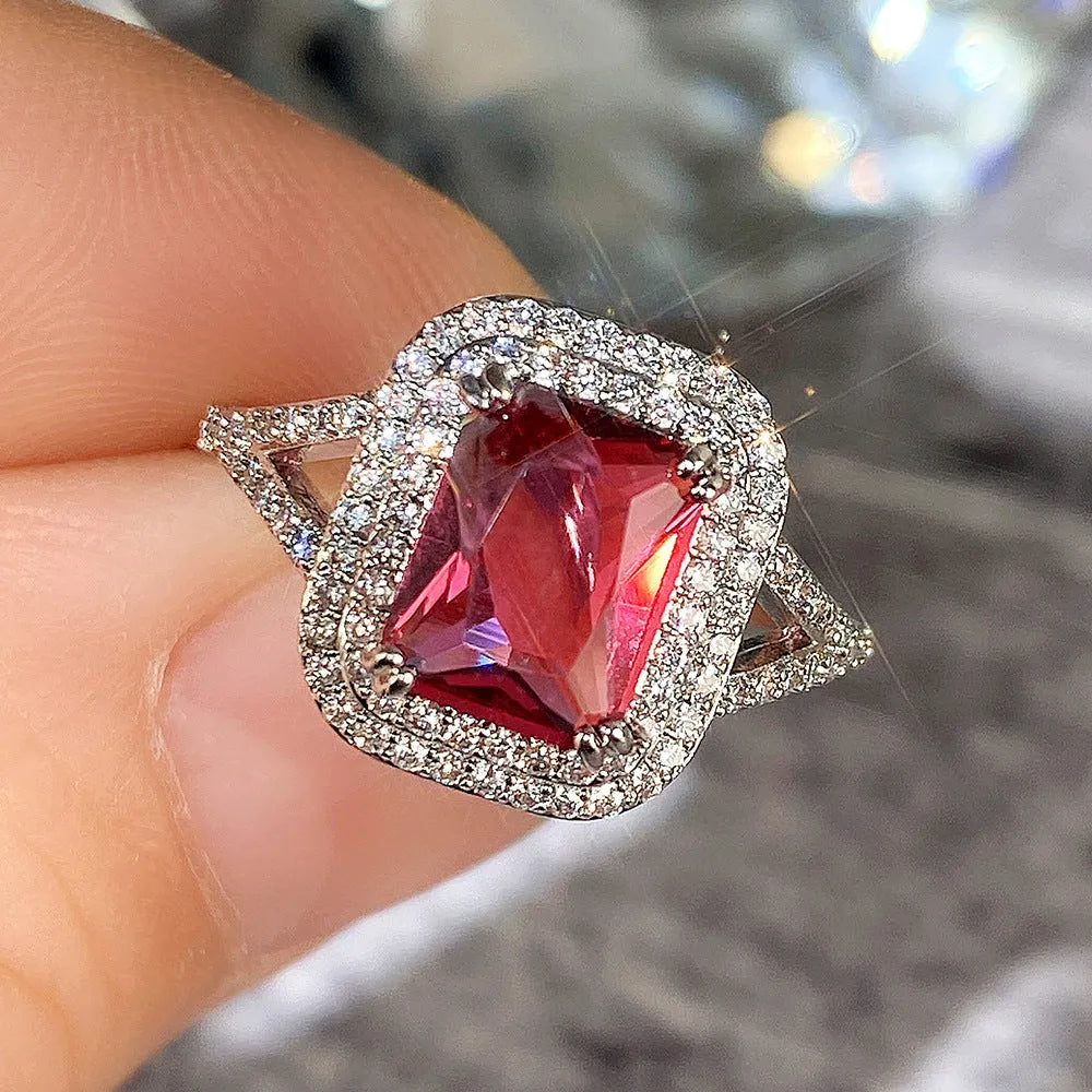 Red copper square women's ring with a geometric shape and central rhinestone decoration.