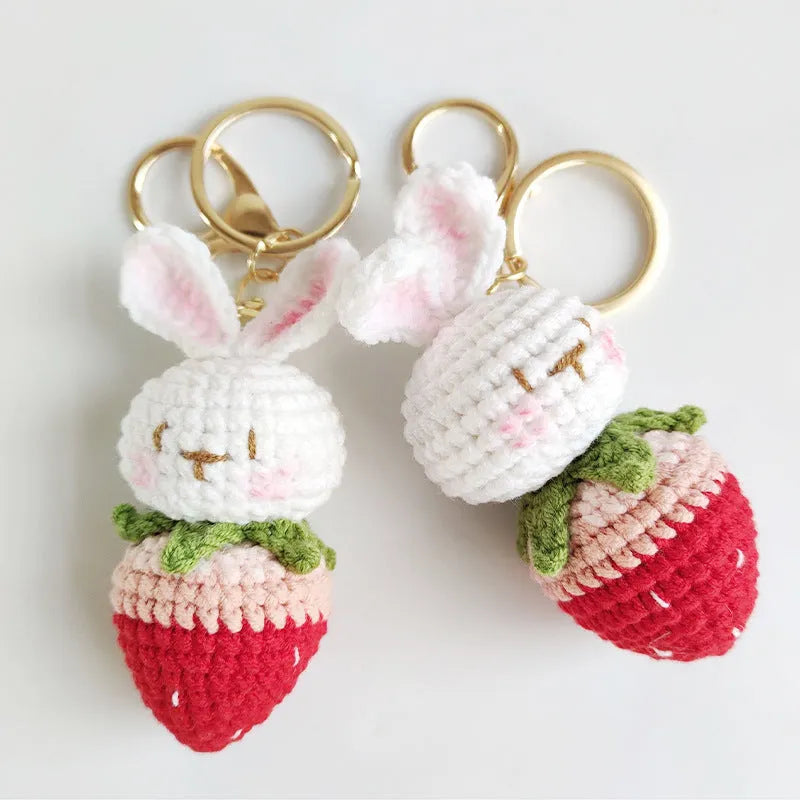 Hand-woven white wire rabbit pendant with strawberry pattern and attached key chain