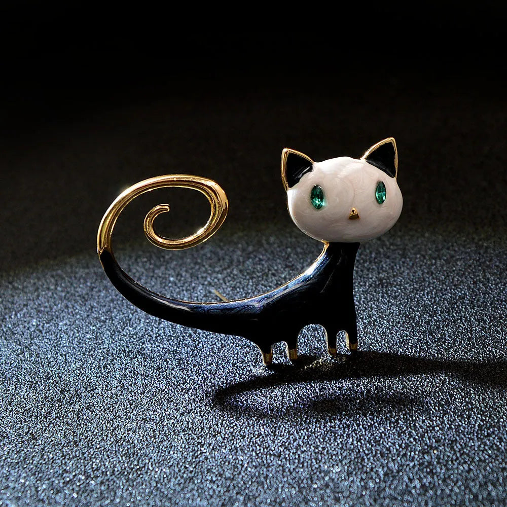 Personalised white and orange alloy cat brooch with painted tail detail.