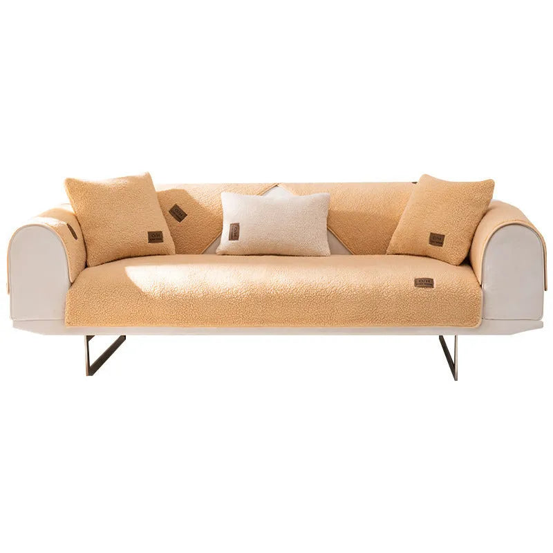 Solid colour lambswool sofa cover on a couch, showing cloth liner and neat fit.