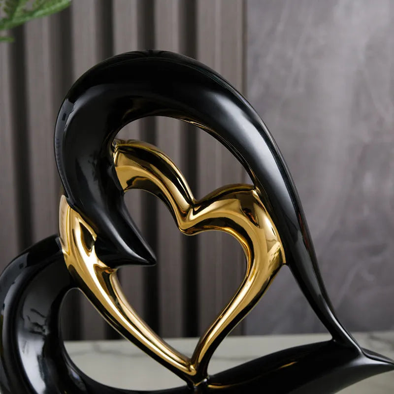 Modern white porcelain heart-shaped geometric ornament in a metallic gold finish.