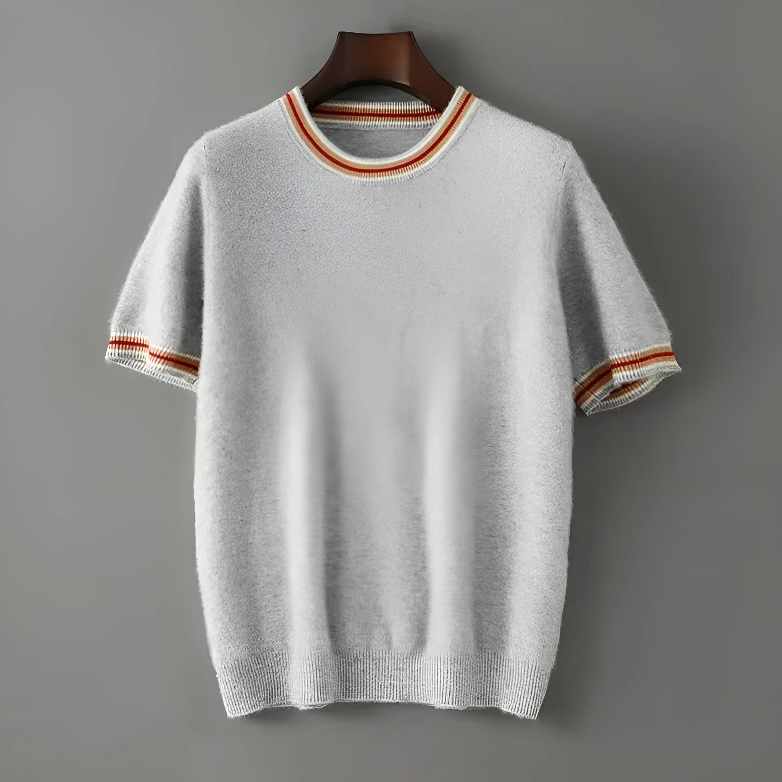 Men's grey round neck short sleeve wool pullover sweater laid flat.