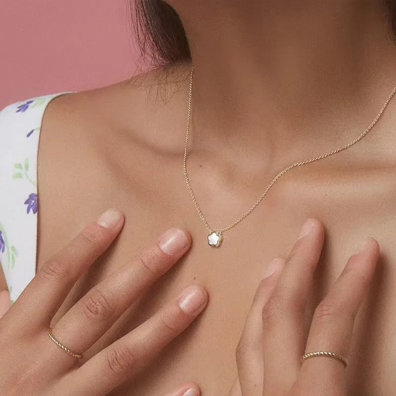 White mother of pearl shell flower necklace on O-shaped chain with gold or silver tone finish