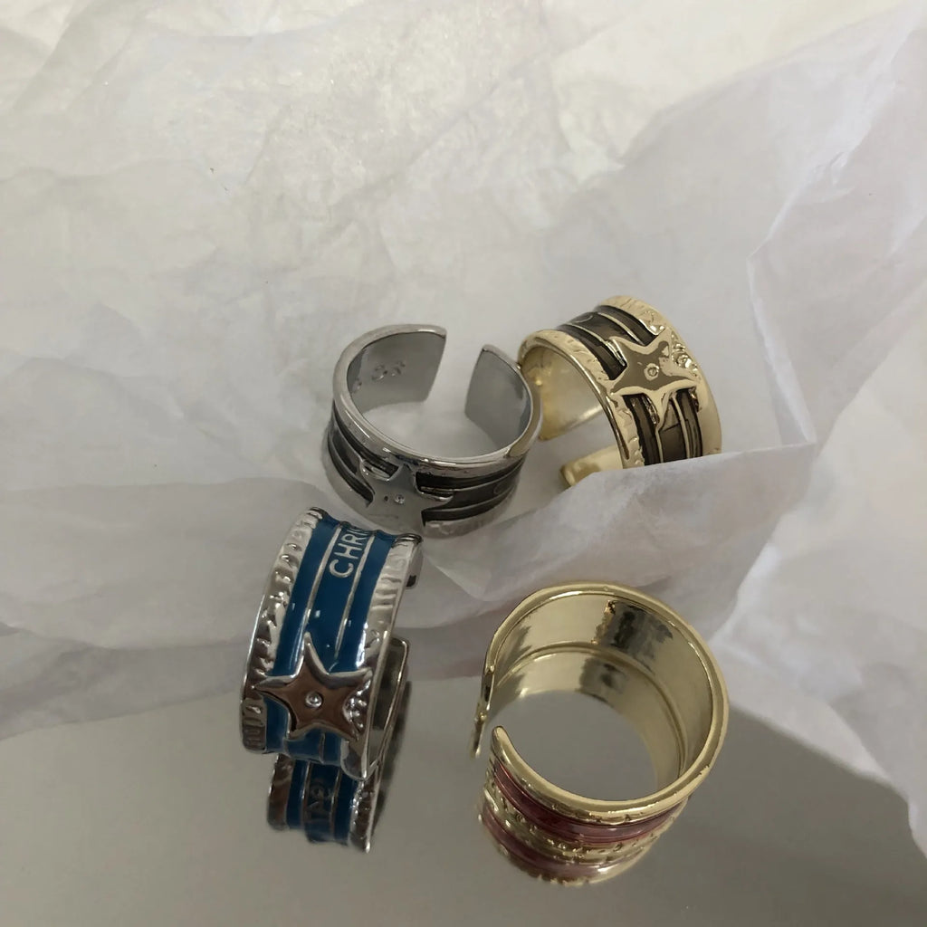 XINGX geometric adjustable copper ring with distressed finish in multiple colours.