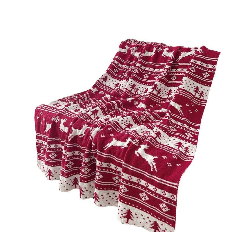 Personalised acrylic Christmas blanket with cartoon reindeer or snowflake pattern on sofa