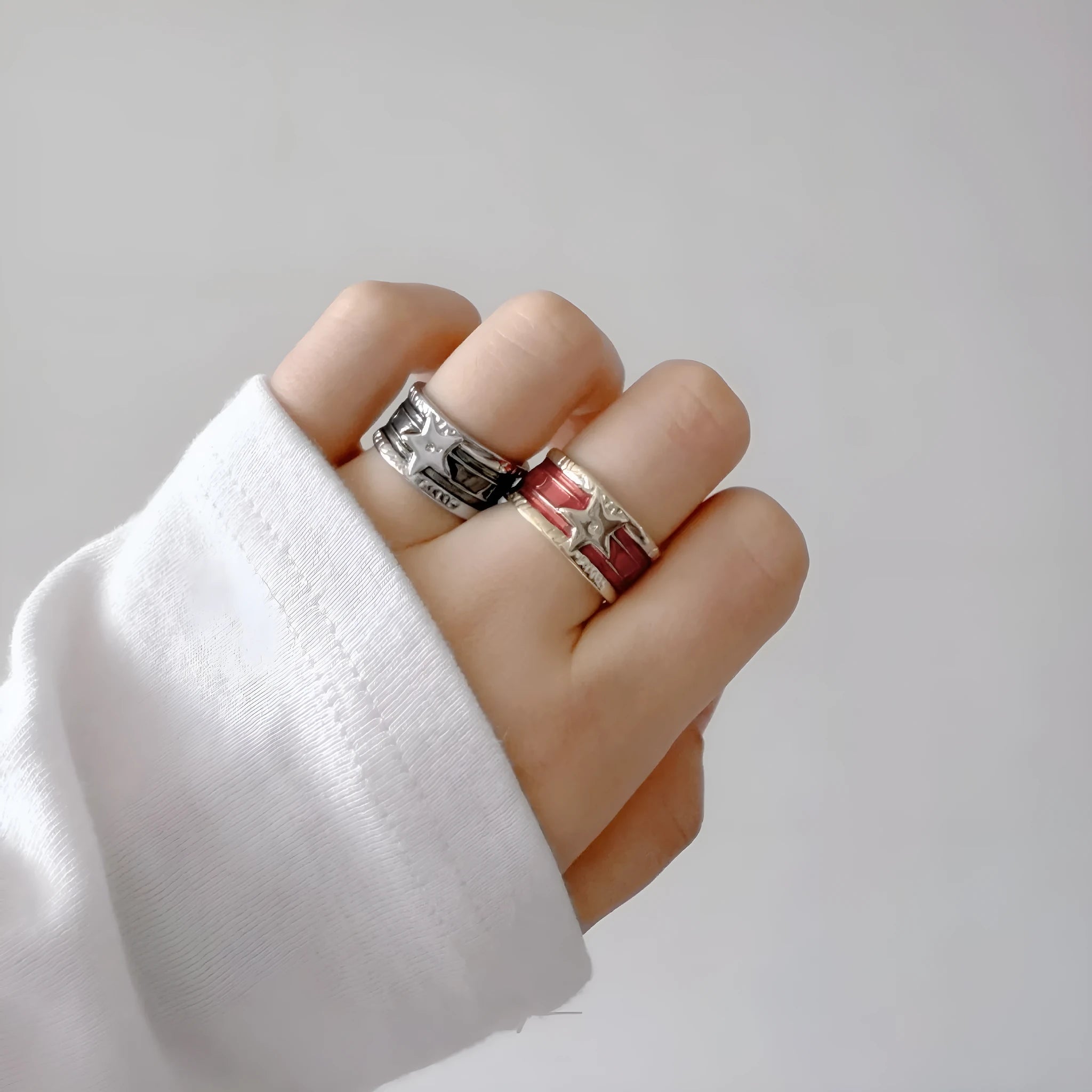 XINGX geometric adjustable copper ring with distressed finish in multiple colours.