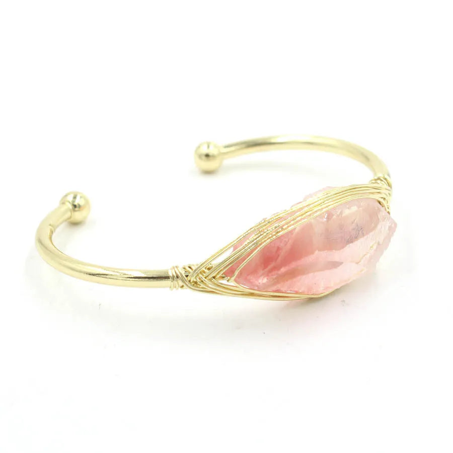 Natural raw gemstone bracelet in amorphous winding shape with simple opening, shown in amethyst crystal colour.