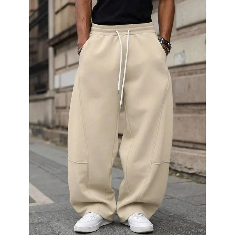Men's high-waisted straight-leg cropped trousers in a neutral colour on a model