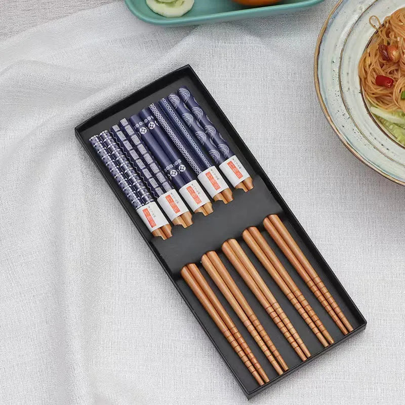 Five pairs of Japanese-style patterned bamboo chopsticks in lucky cat or elegant blue designs with cartoon patterns