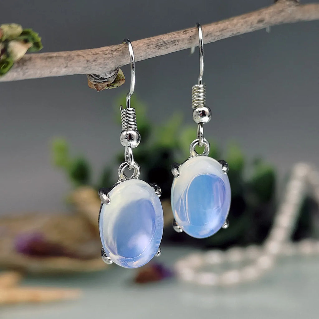 Retro moonstone opal cross drop earrings in electroplated alloy with moonlight white colour