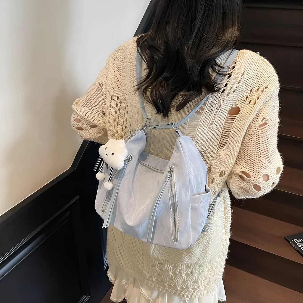 Women's soft PU fashion backpack in black with matching pendant accessory