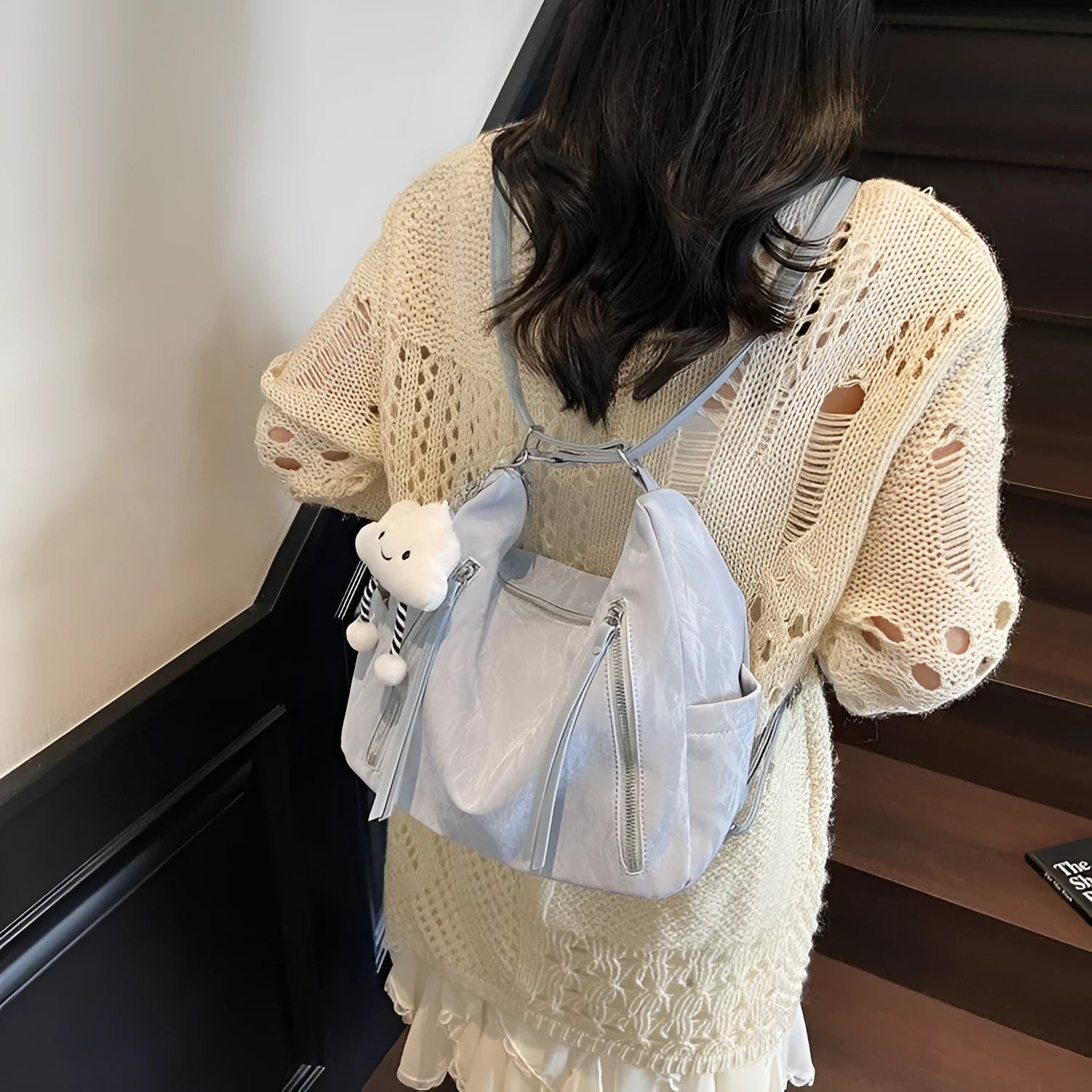Women's soft PU fashion backpack in black with matching pendant accessory