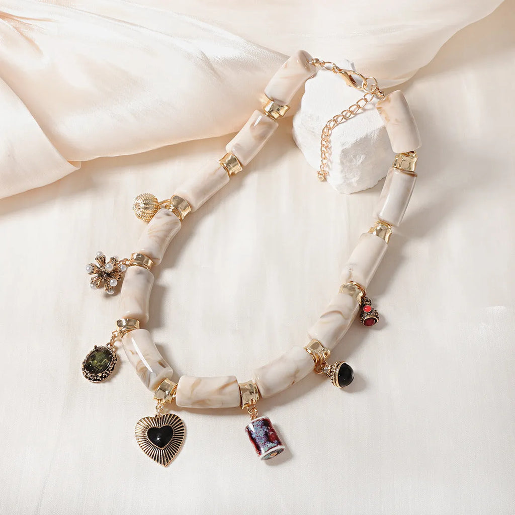 Heart-shaped resin bamboo necklace with electroplated finish on adjustable chain