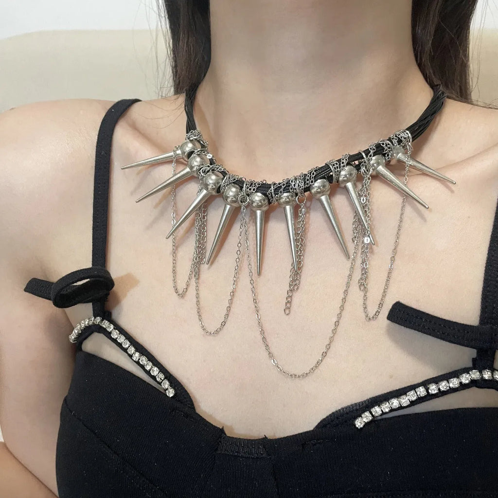 Women's leather tassel necklace with winding beads and silver rivet details in picture colour.