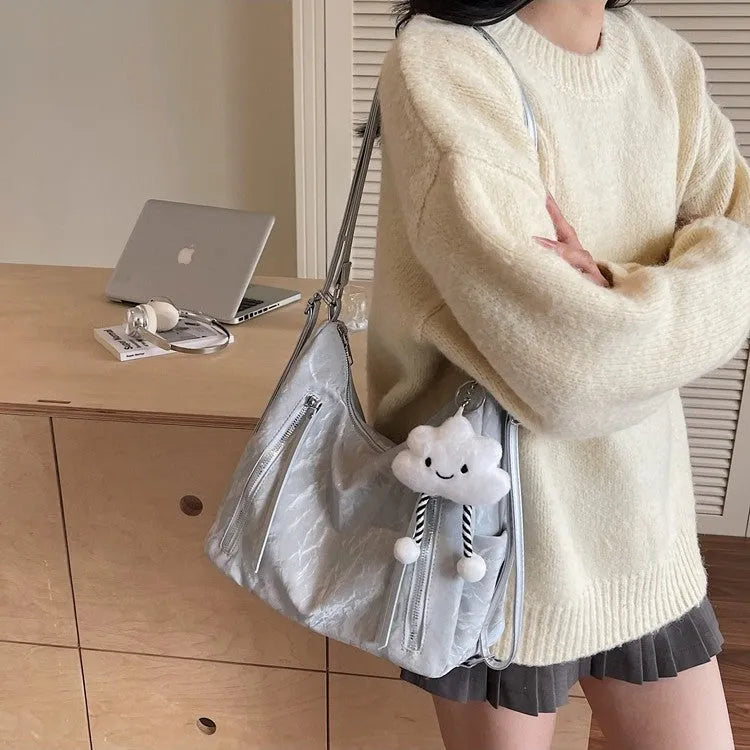 Women's soft PU fashion backpack in black with matching pendant accessory