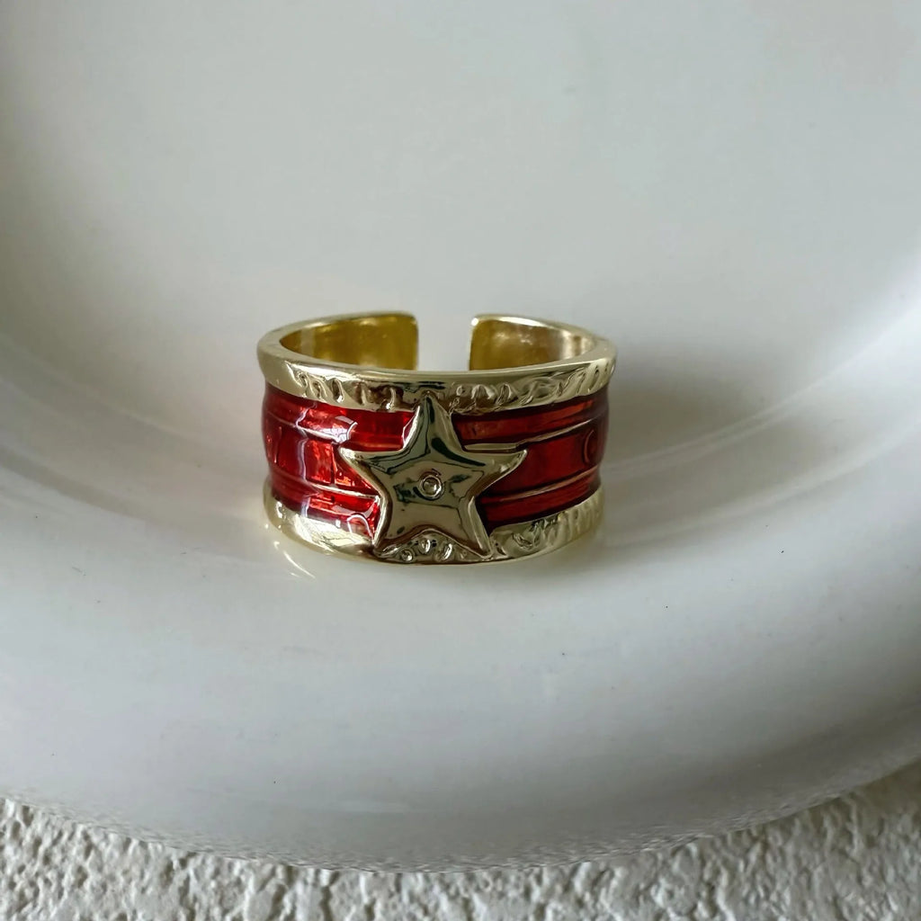 XINGX geometric adjustable copper ring with distressed finish in multiple colours.