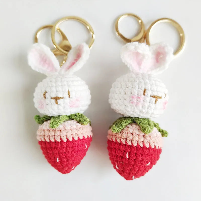 Hand-woven white wire rabbit pendant with strawberry pattern and attached key chain