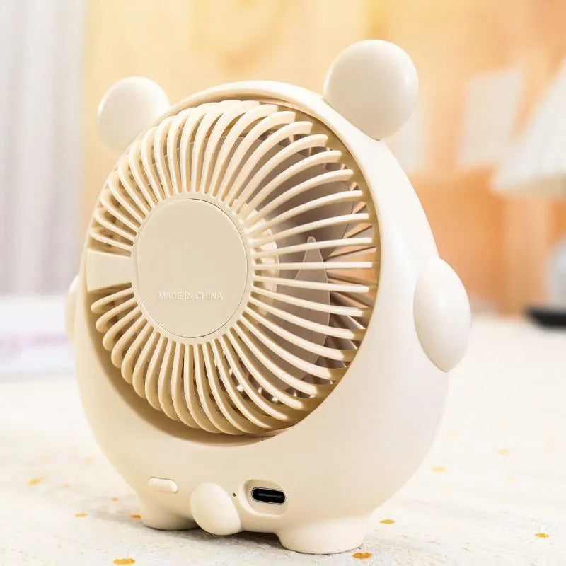 USB desk fan with bear and puppy design showing brown, apricot, and pink colour options.