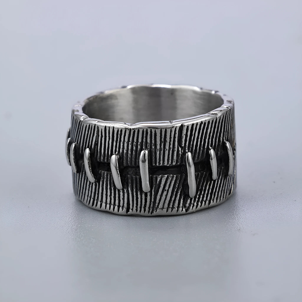 Titanium steel geometric U-shaped double ring with stitched texture in a retro colour.