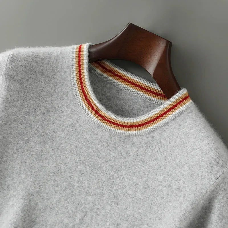 Men's grey round neck short sleeve wool pullover sweater laid flat.