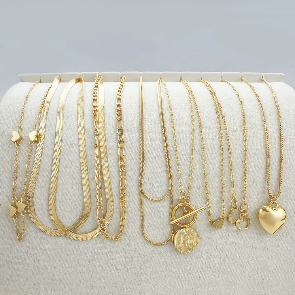 Gold electroplated women's necklace set with 10 alloy pendant pieces on snake bones chains