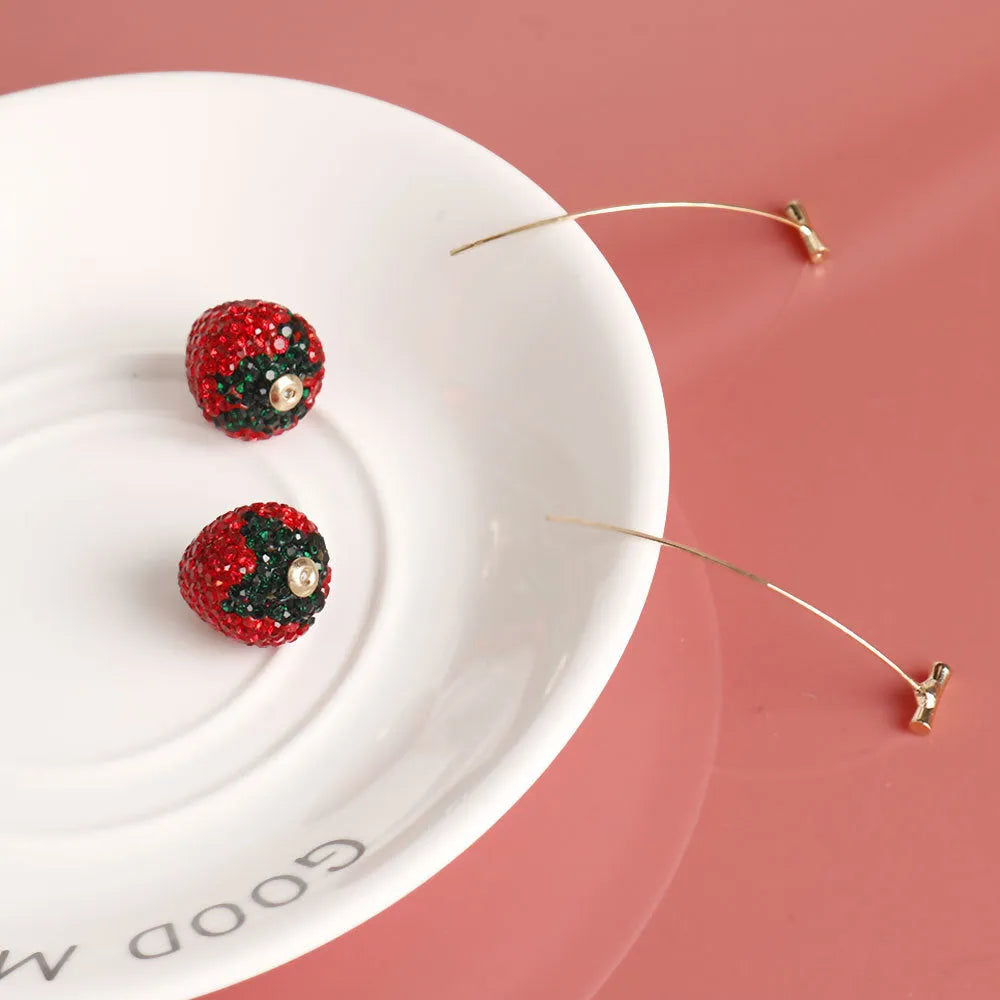 Red geometric strawberry stud earrings made from zinc alloy for women.
