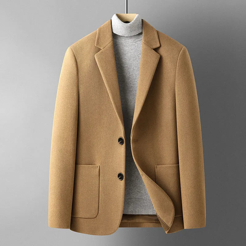Men's slim-fit wool suit in grey on a hanger, showing single-breasted jacket and trousers.