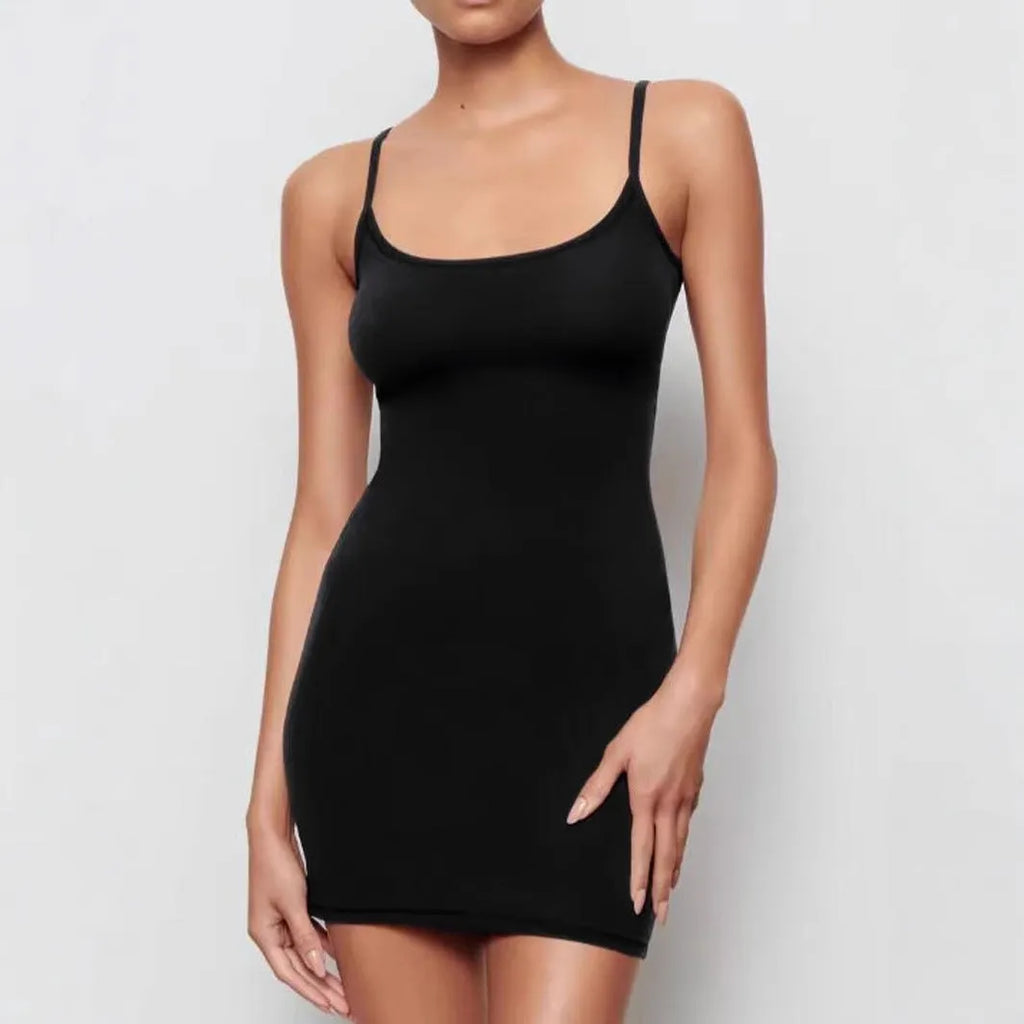 Black sling dress with skinny sheath silhouette and sleeveless design