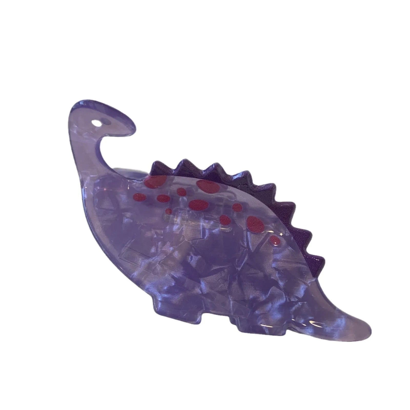 Dinosaur acrylic jaw clip hairpin showing colourful dinosaur designs including pink pterosaur and green stegosaurus