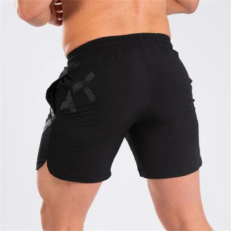 Men's black elastic training shorts with a mid-waist and knee-length cut for summer sports.