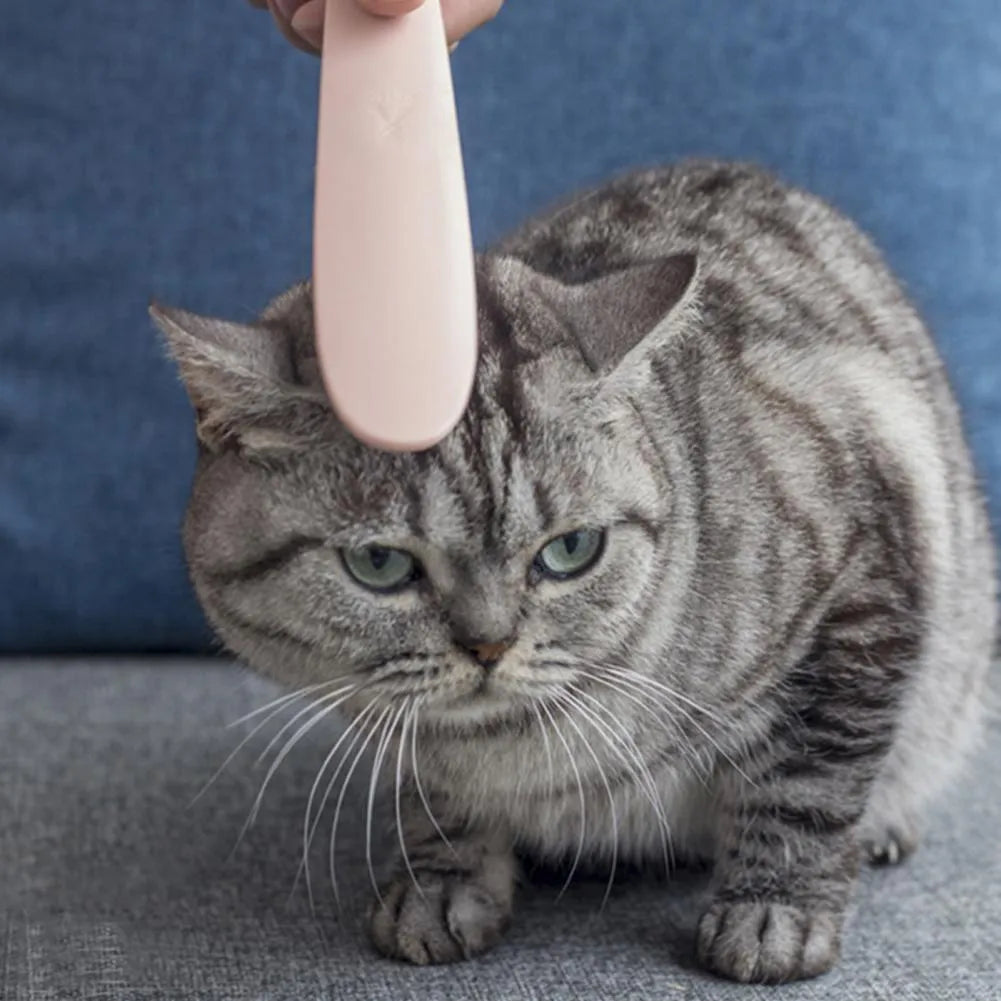 Grey and pink ABS plastic cat grooming comb with narrow and wide ends for pet hair removal