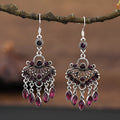 Pair of long purple drop shape fringe earrings with crystals in a retro ethnic style.