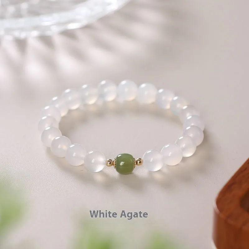 Handmade white agate and crystal bracelet with cinnabar inlay, showing 6mm or 8mm bead size.