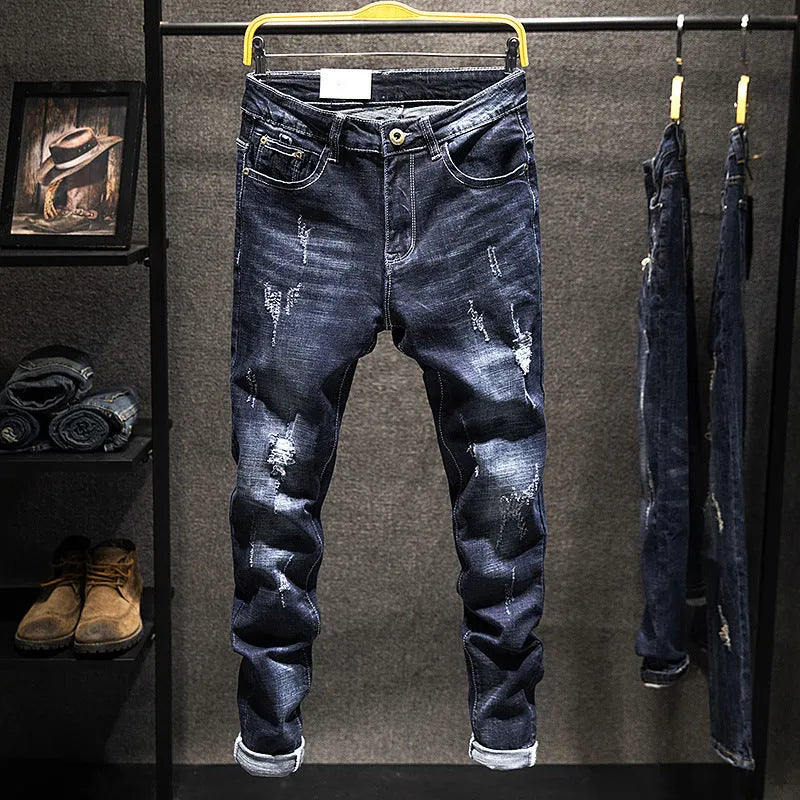 Men's dark blue skinny jeans with a slim fit, shown on a model.