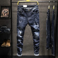 Men's dark blue skinny jeans with a slim fit, shown on a model.