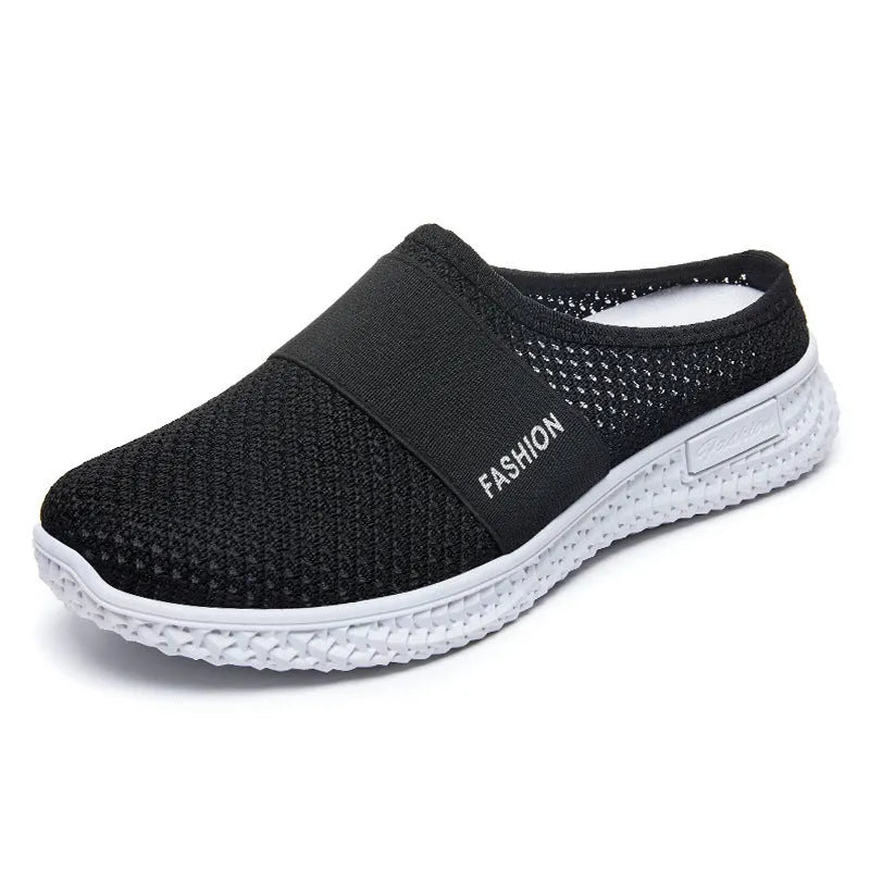 Women's casual flat shoe in breathable mesh, showing hollow-out detail and round toe, in a choice of colours.